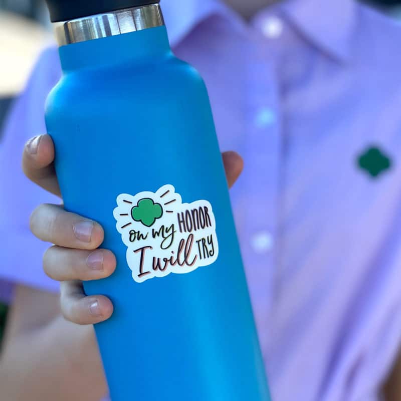 On my honor sticker on blue water bottle