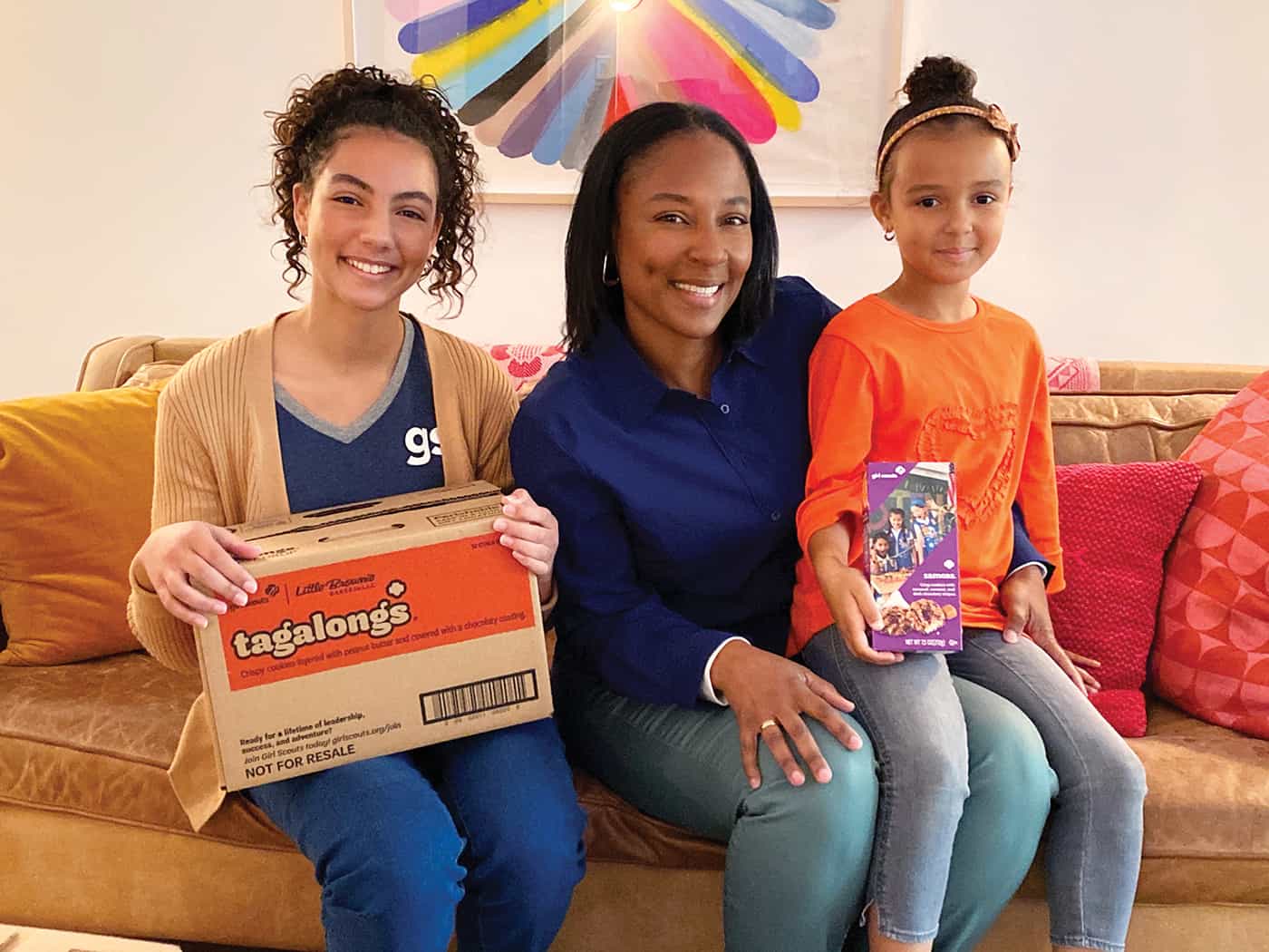 Girl Scout family sitting on a couch